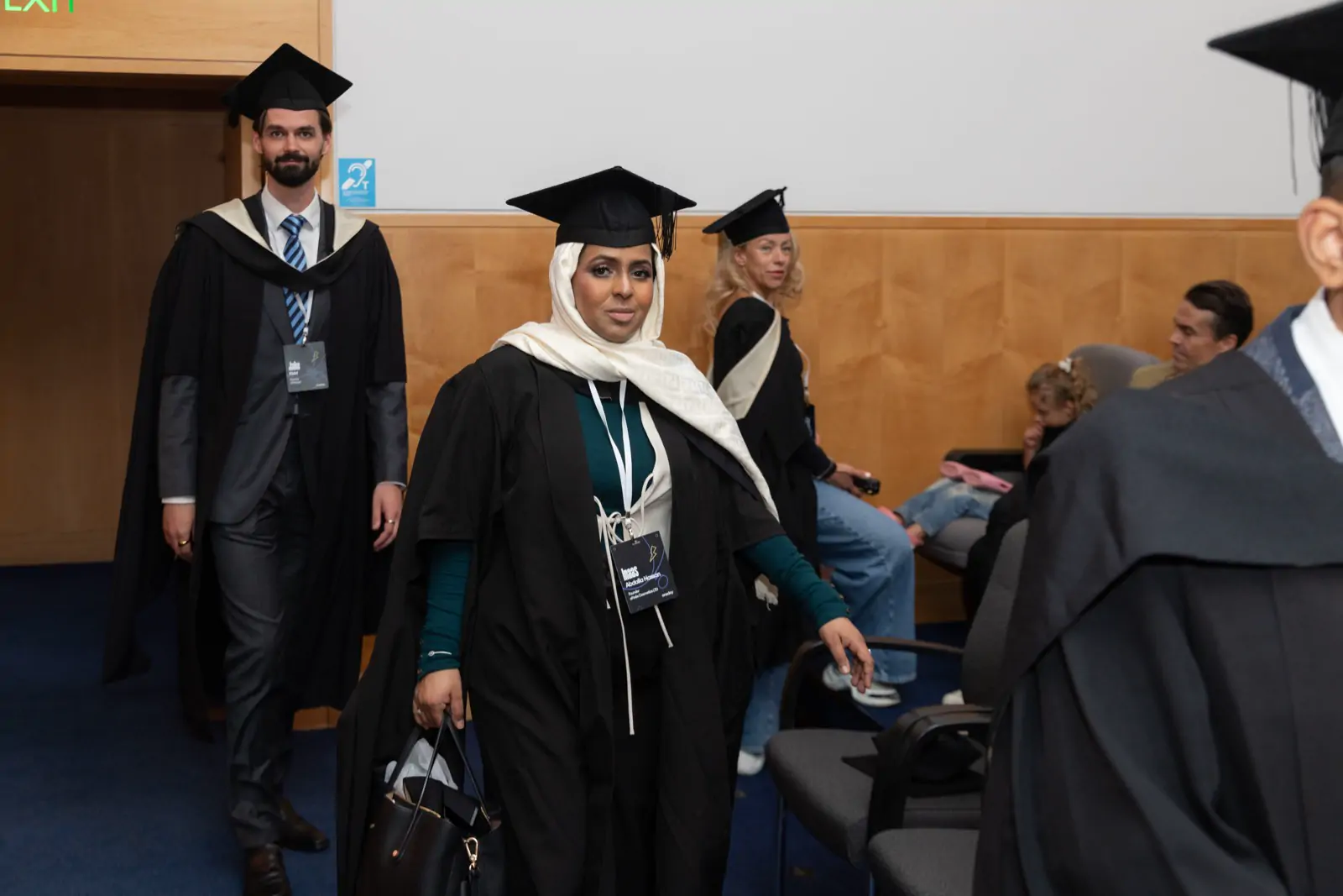 Graduates walking in together before the ceremony